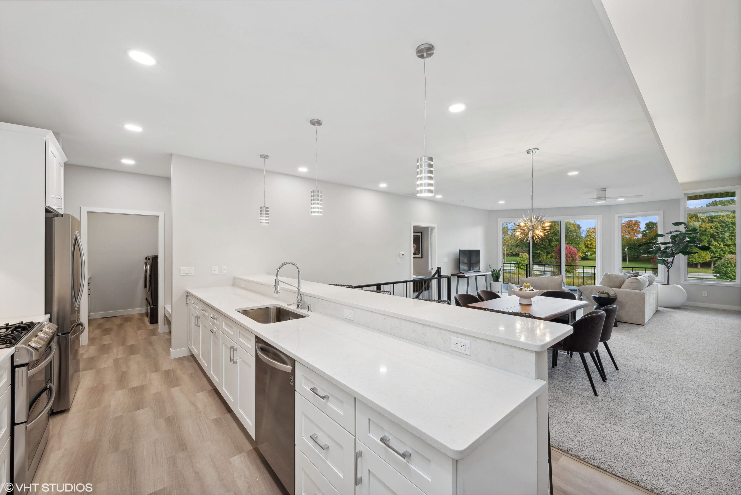 Townhome interior showing living room, dining room, and kitchen