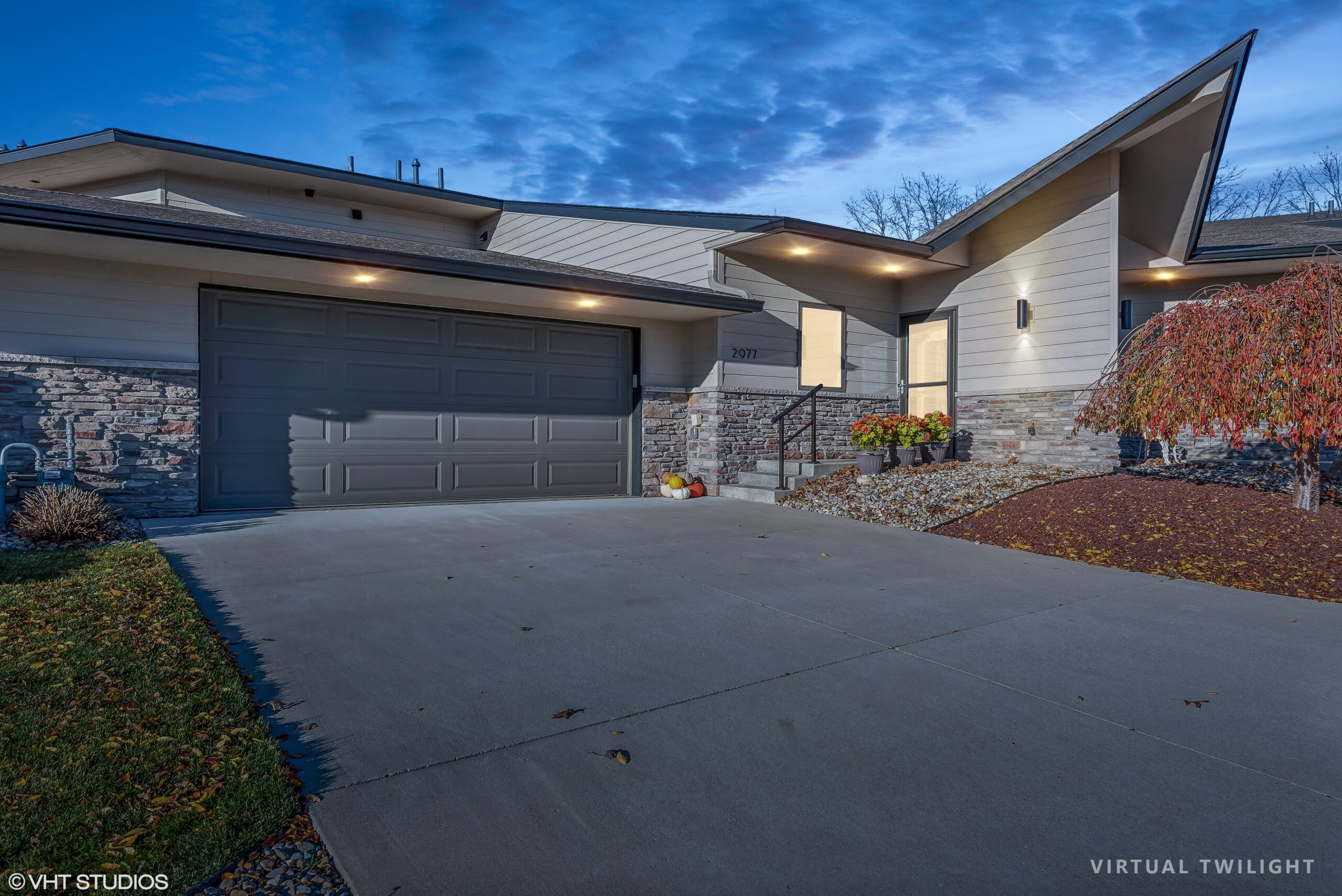 Evening exterior of residential townhome designed by GMF Architecture & Development.